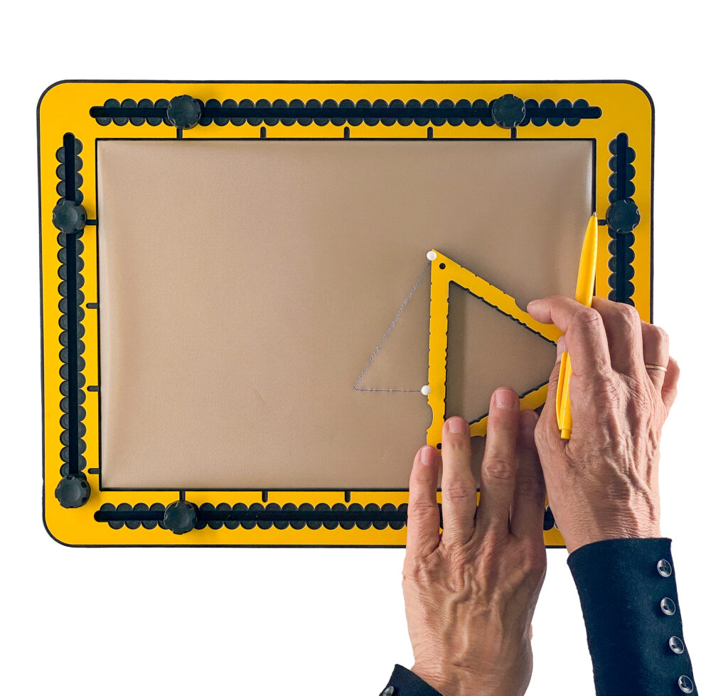 Completing the right-angled triangle by connecting the ends of first two lines, marked by pushpins.
