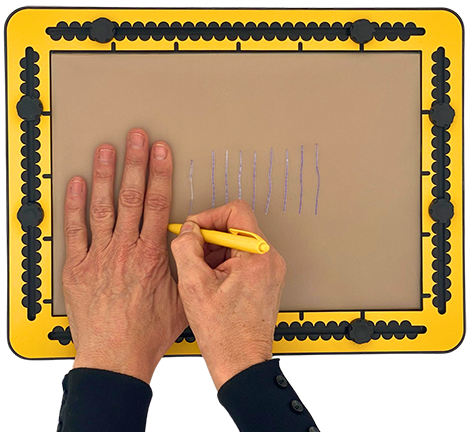 The left hand resting flat on the TactiPad while the right hand uses a pen to draw several short, parallel lines next to the left hands pointing finger.