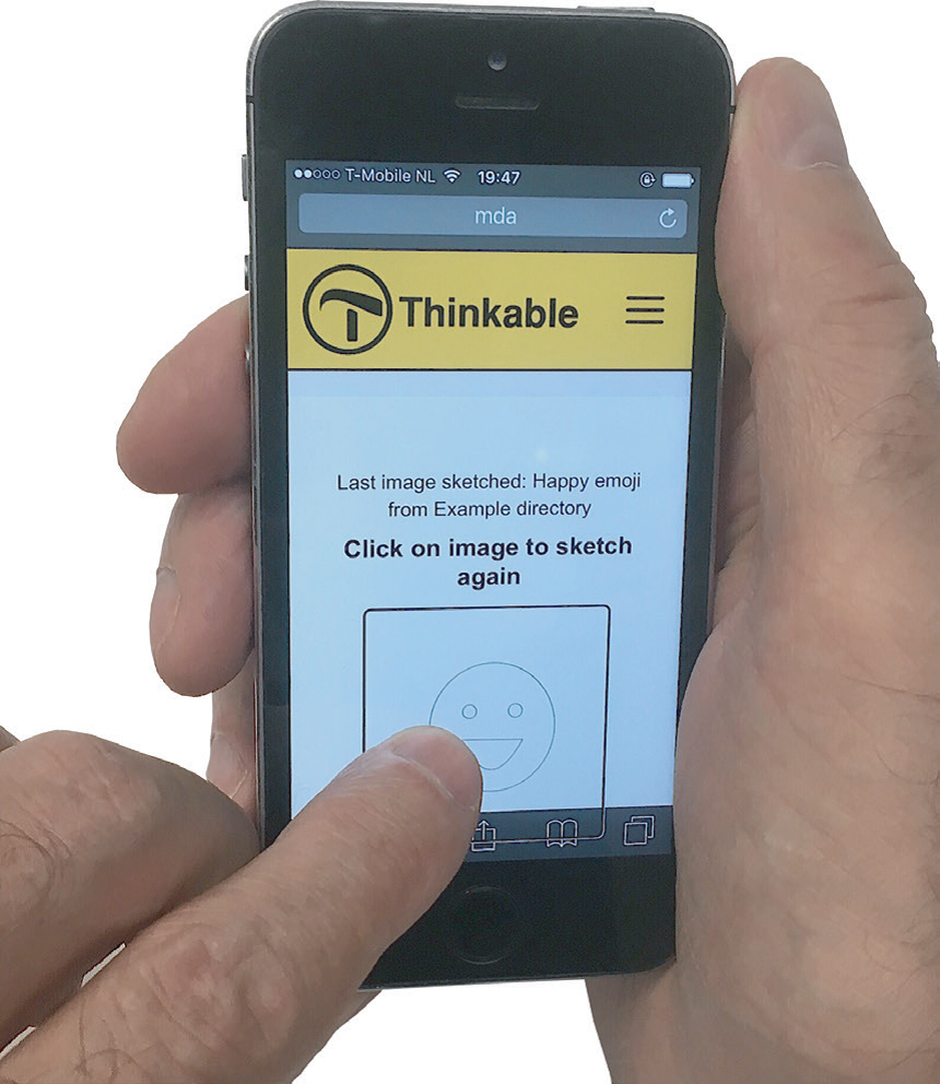 MDA website being accessed on a mobile phone, displaying a smiley that is ready to be sketched