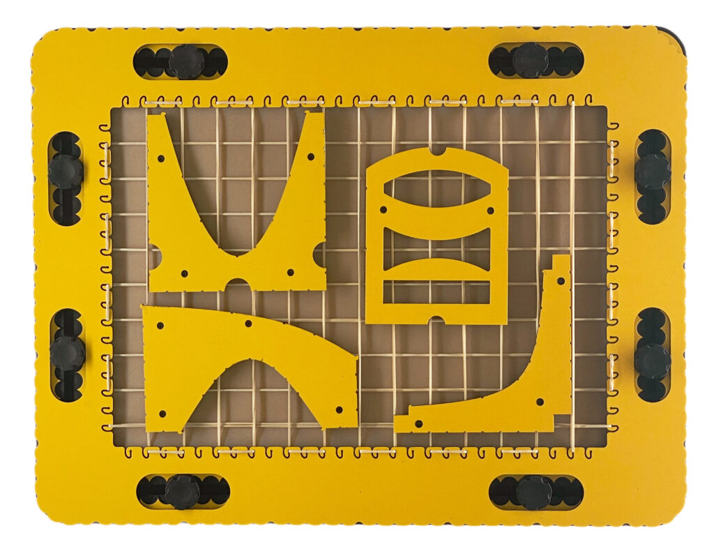 The GraphGrid on a TactiPad, with four tools placed on the grid: parabola, hyperbola, sintang, and lens.